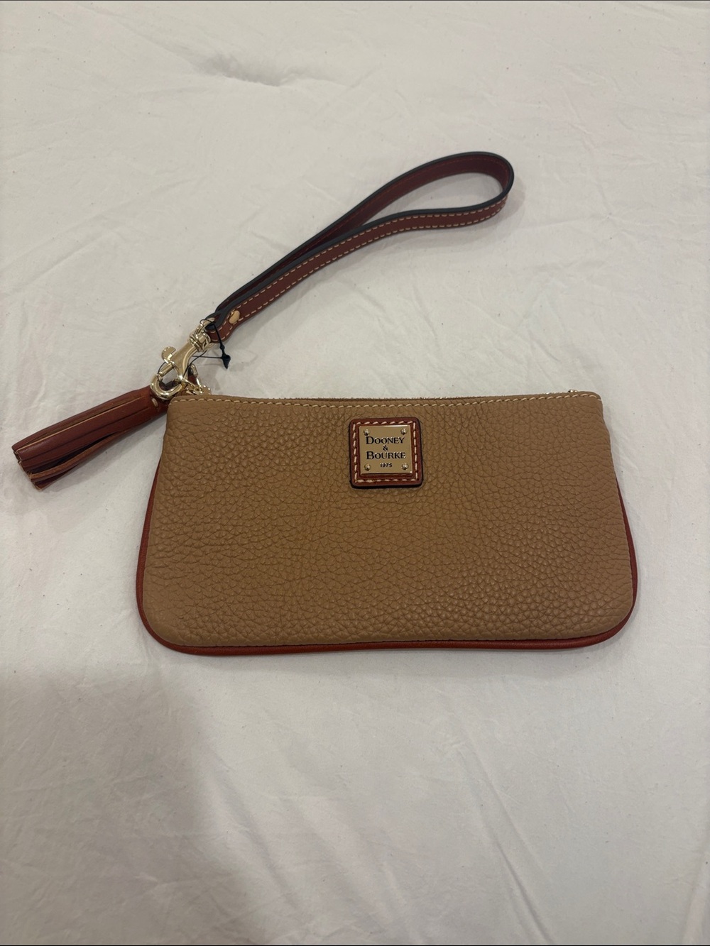 Dooney & Bourke Tan Pebbled Leather Wristlet with Red Trim